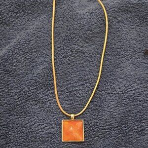 Elegant Gold and Orange Resin Pendant Necklace